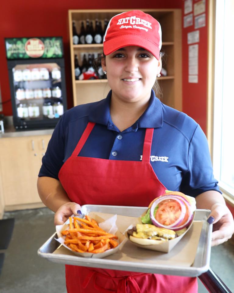 Hat Creek lady serving burgers